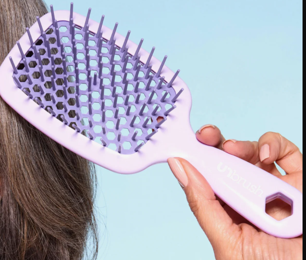 Purple flexible vent detangling brush with open frame and separated rows